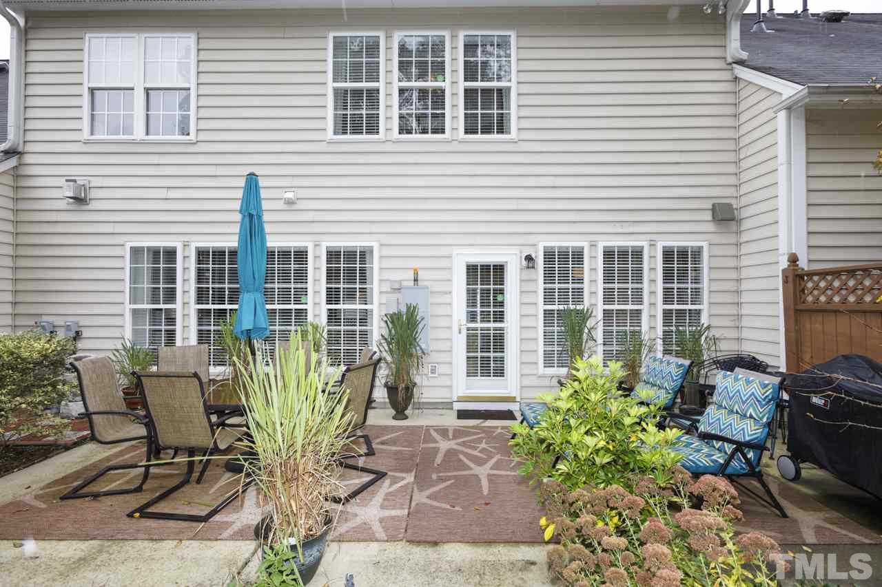 3743 Old Post Road Raleigh, NC 27612 - Photo 24 of 25 a view of a chair and table in the patio