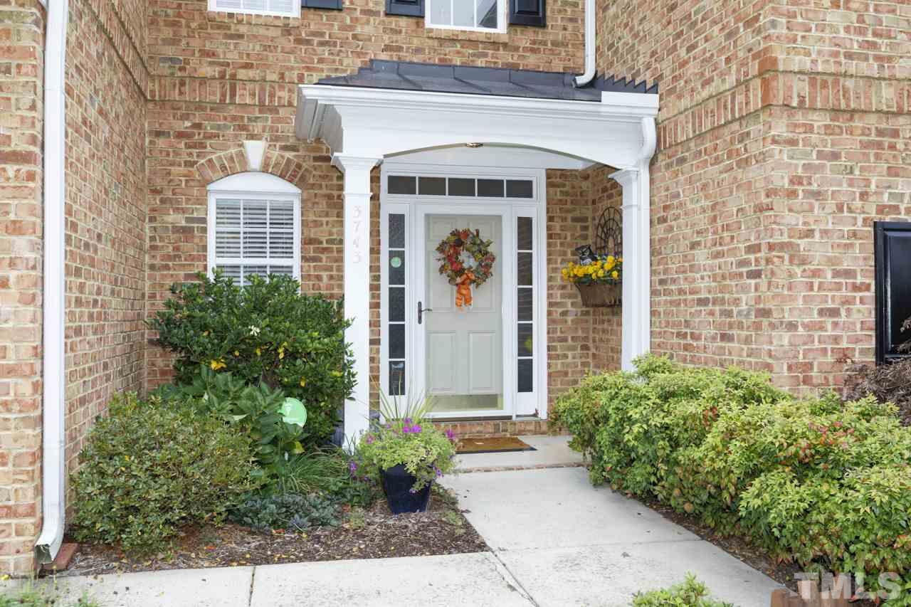 3743 Old Post Road Raleigh, NC 27612 - Photo 25 of 25 a front view of a house with garden