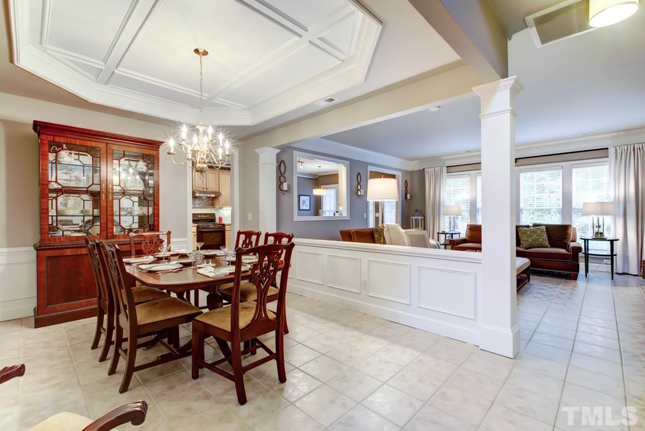 3743 Old Post Road Raleigh, NC 27612 - Photo 4 of 25 a view of a dining room with furniture and a chandelier