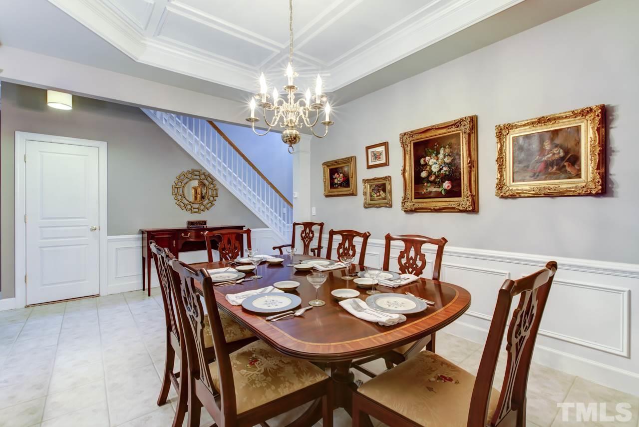 3743 Old Post Road Raleigh, NC 27612 - Photo 5 of 25 a view of a dining room with furniture and chandelier