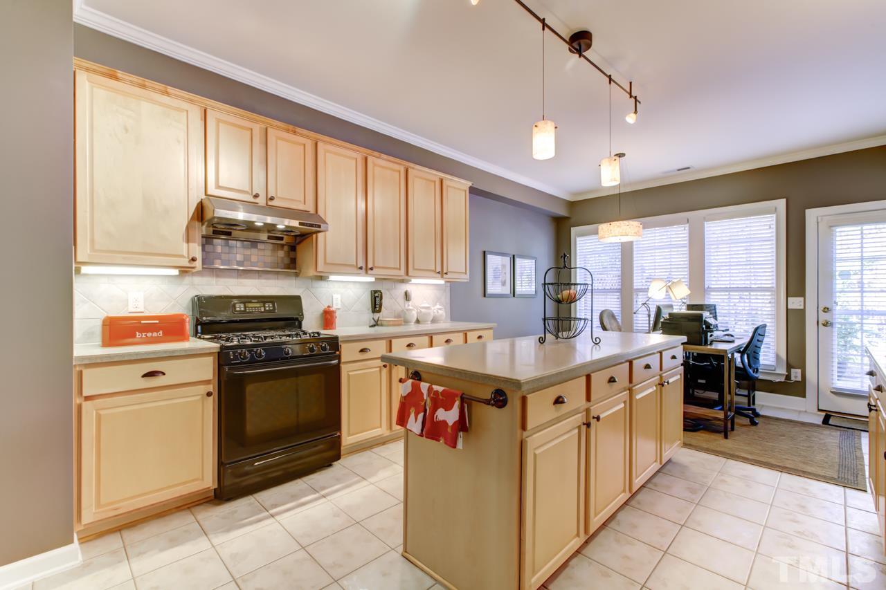 3743 Old Post Road Raleigh, NC 27612 - Photo 8 of 25 a kitchen with stainless steel appliances granite countertop a stove a sink dishwasher and a refrigerator