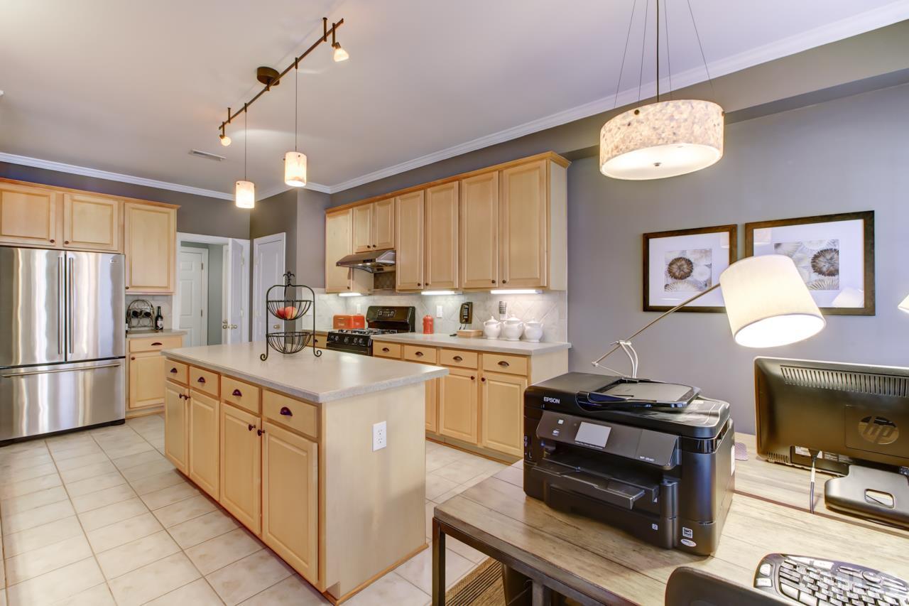 3743 Old Post Road Raleigh, NC 27612 - Photo 10 of 25 a kitchen with cabinets and window