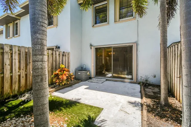 a view of a house with a porch and furniture