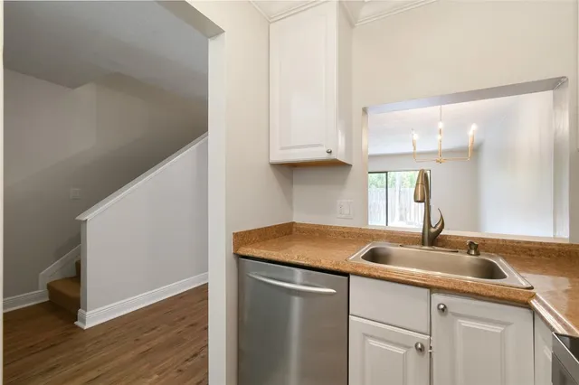 a kitchen with a sink and cabinets