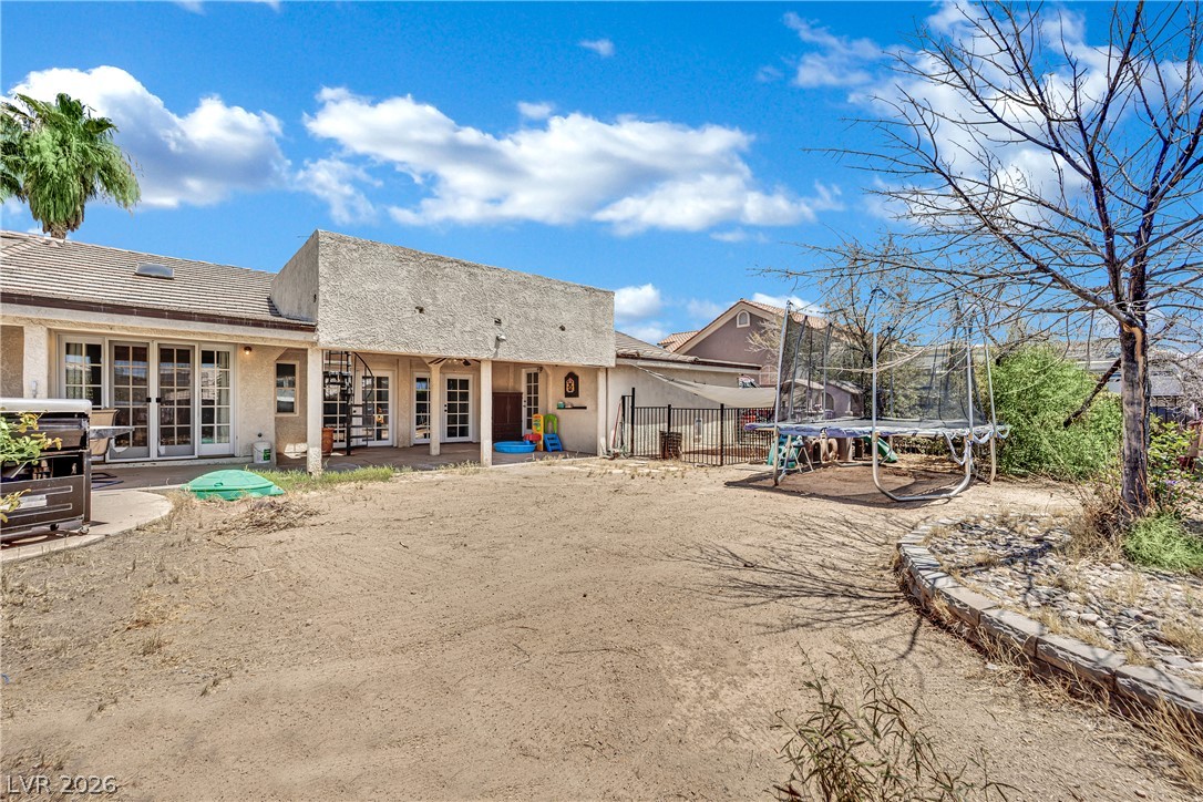 420 North Racetrack Road Henderson, NV 89015 - Photo 40 of 52 A spacious backyard with a patio provides ample space for recreation and outdoor enjoyment.