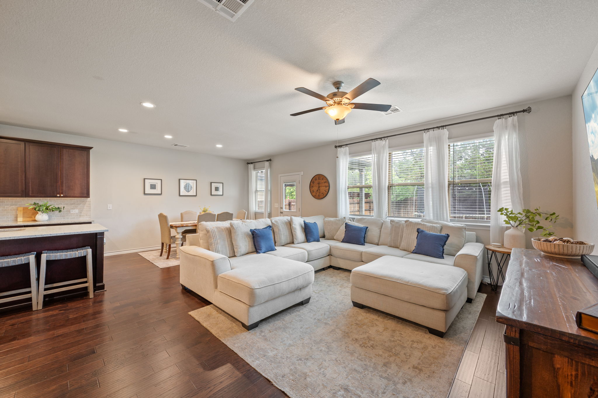 409 Limestone Road Liberty Hill, TX 78642 - Photo 12 of 35 a living room with furniture fireplace and a large window