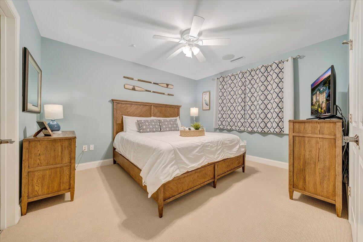 100 Bridgewater Pointe Place, Unit 502 Moneta, VA 24121 - Photo 12 of 54 a bedroom with a bed and a chandelier