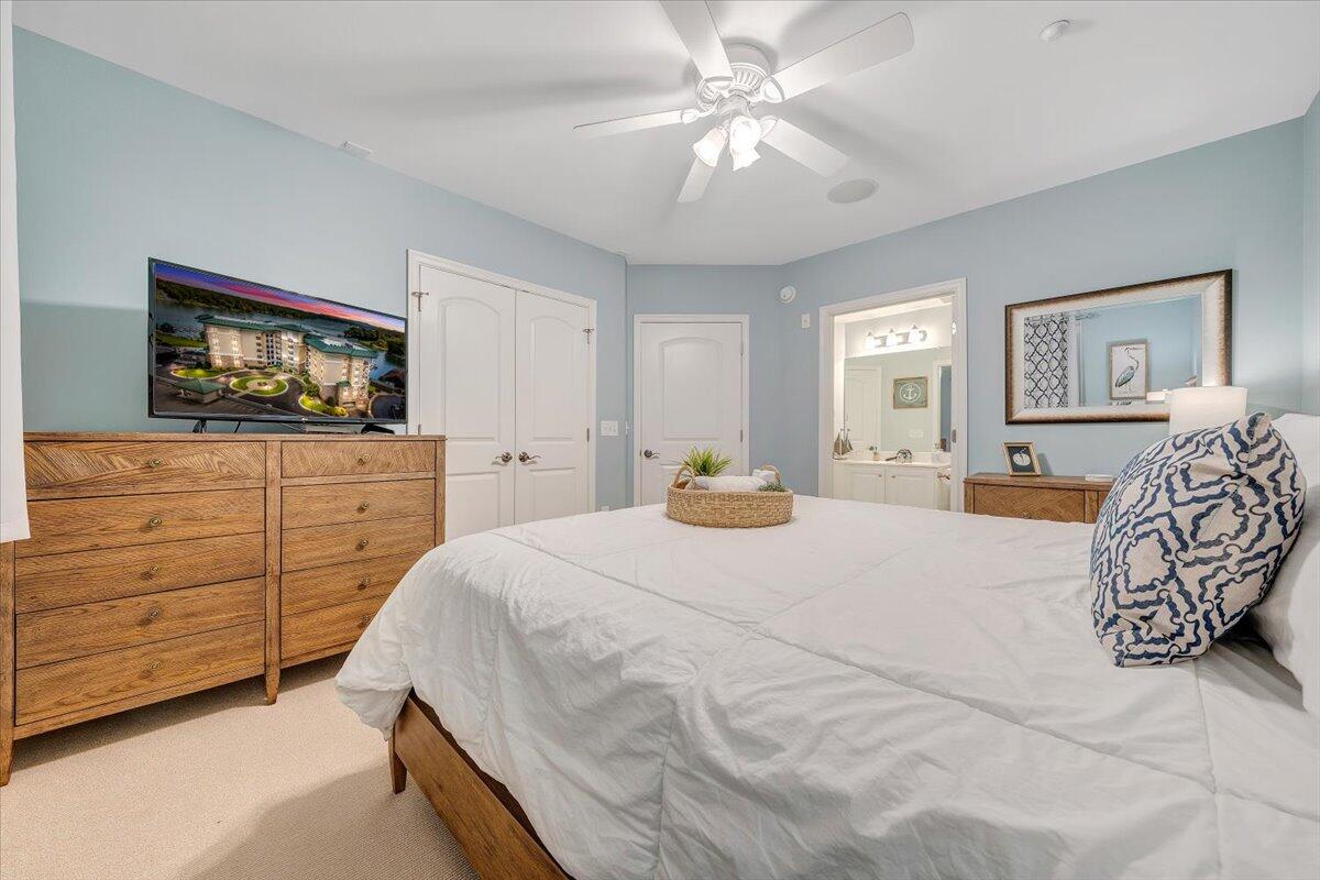 100 Bridgewater Pointe Place, Unit 502 Moneta, VA 24121 - Photo 13 of 54 a bedroom with a large bed and a dresser