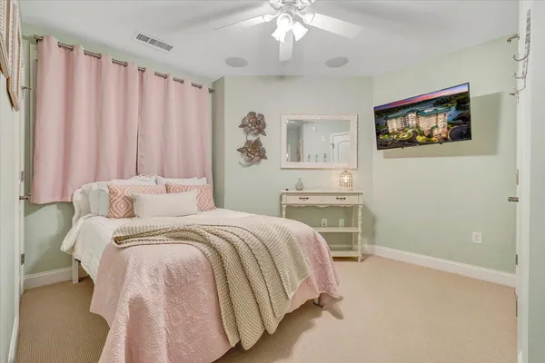 a bed room with a bed and a chandelier