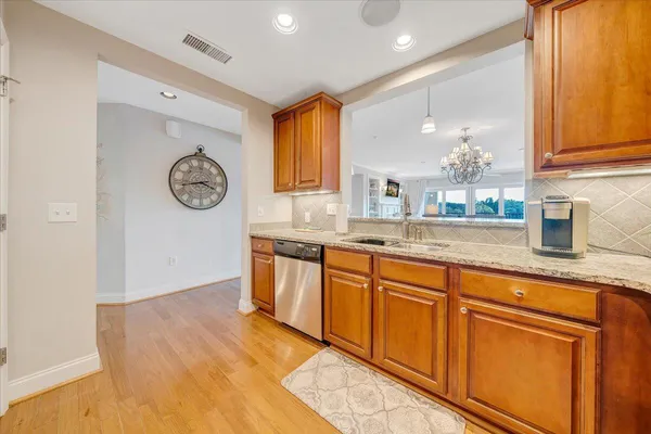 a spacious bathroom with a sink and a large mirror