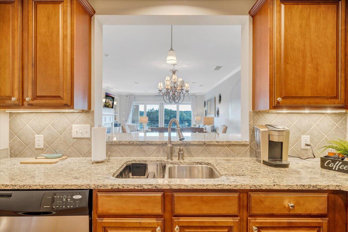 100 Bridgewater Pointe Place, Unit 502 Moneta, VA 24121 - Photo 17 of 54 a kitchen with stainless steel appliances granite countertop a sink and cabinets