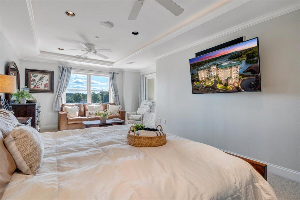 100 Bridgewater Pointe Place, Unit 502 Moneta, VA 24121 - Photo 36 of 54 a bedroom with a bed and a large window