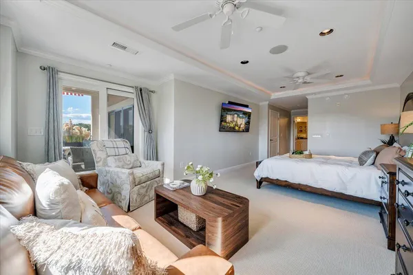 a bedroom with a bed and cabinet