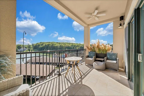 a view of balcony with furniture
