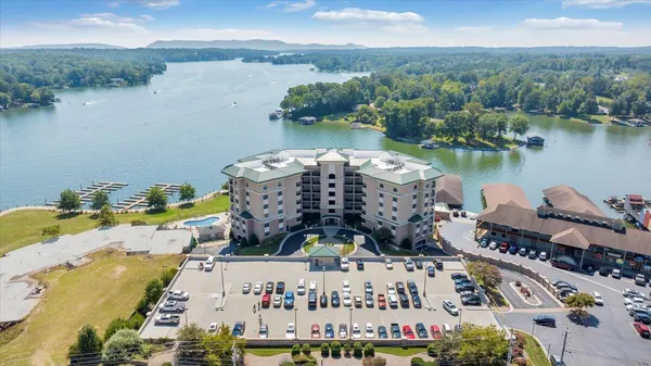 an aerial view of a house with outdoor space lake view