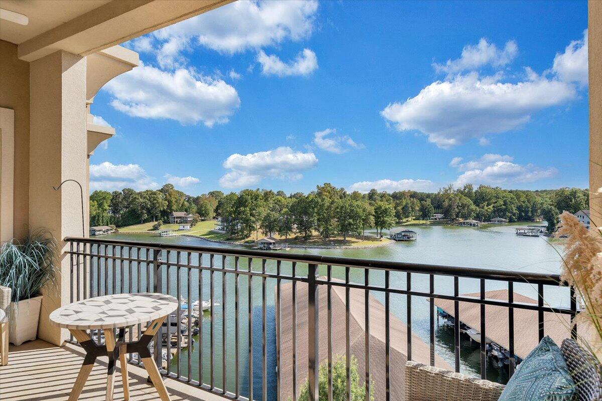 100 Bridgewater Pointe Place, Unit 502 Moneta, VA 24121 - Photo 5 of 54 a view of a balcony with wooden chairs
