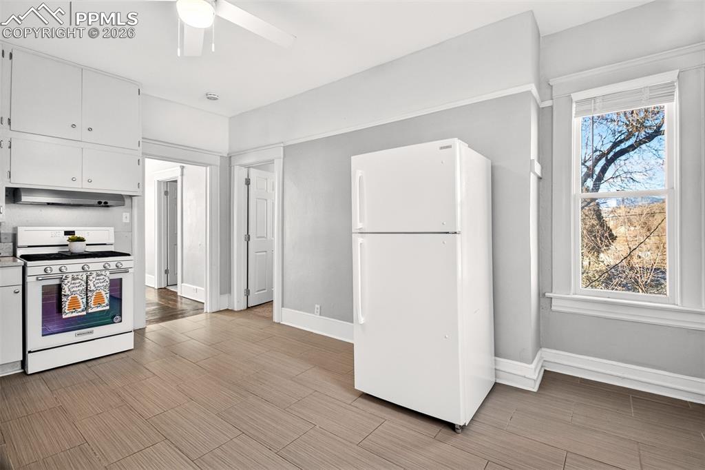 4 West Harrison Street Colorado Springs, CO 80907 - Photo 12 of 49 a view of kitchen with window and refrigerator