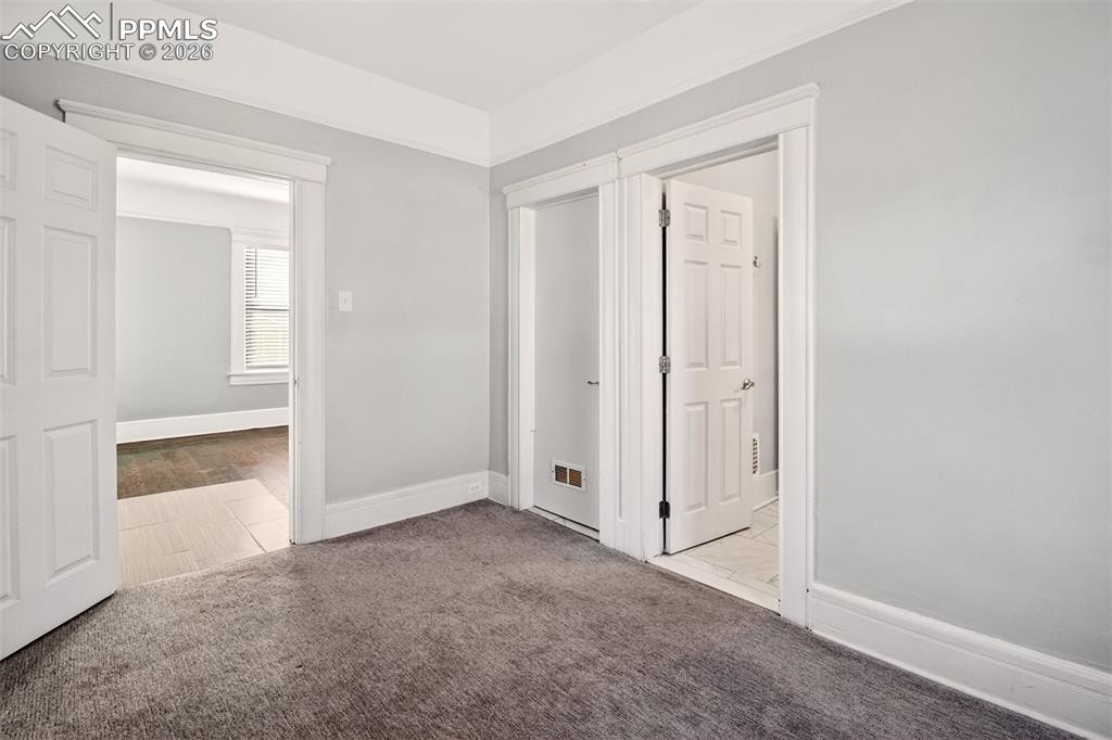 4 West Harrison Street Colorado Springs, CO 80907 - Photo 17 of 49 an empty room with windows and closet