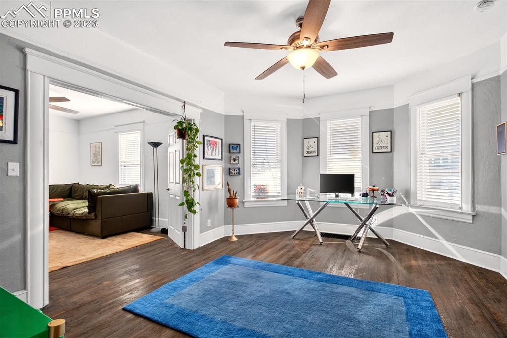 4 West Harrison Street Colorado Springs, CO 80907 - Photo 24 of 49 a living room with furniture and a wooden floor