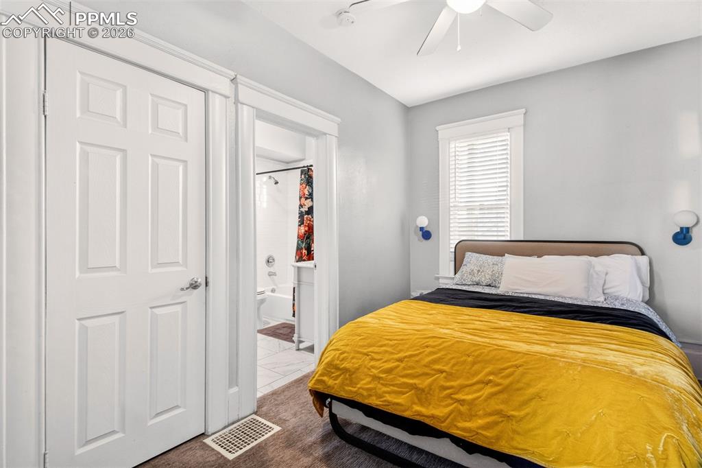 4 West Harrison Street Colorado Springs, CO 80907 - Photo 28 of 49 a bed sitting in a bedroom next to a window