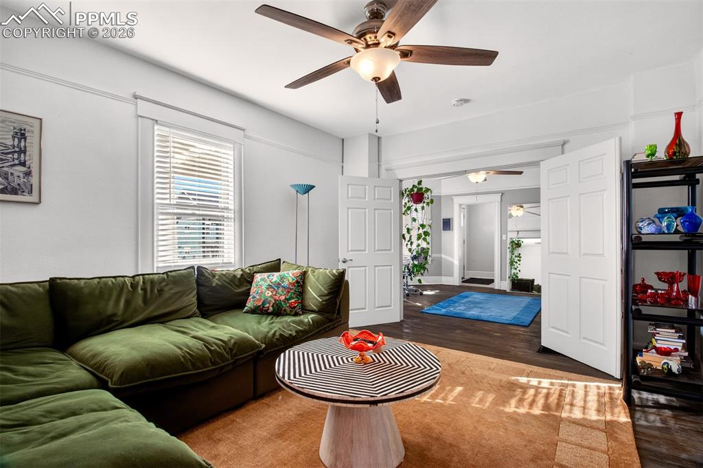 4 West Harrison Street Colorado Springs, CO 80907 - Photo 30 of 49 a living room with furniture and a book shelf