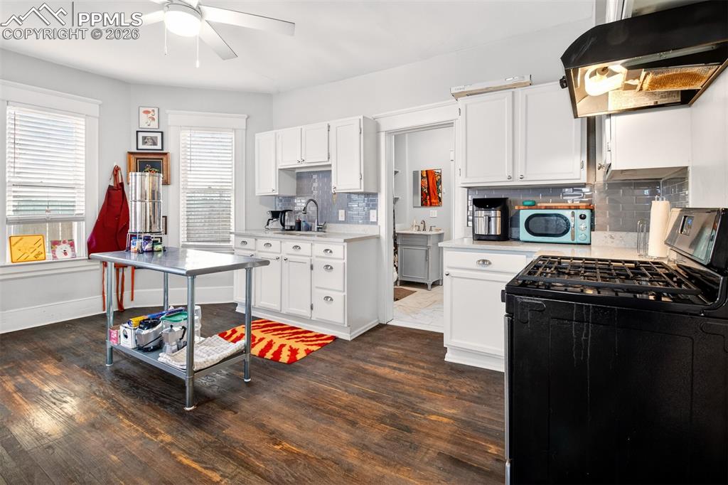 4 West Harrison Street Colorado Springs, CO 80907 - Photo 33 of 49 a living room with furniture and a fireplace