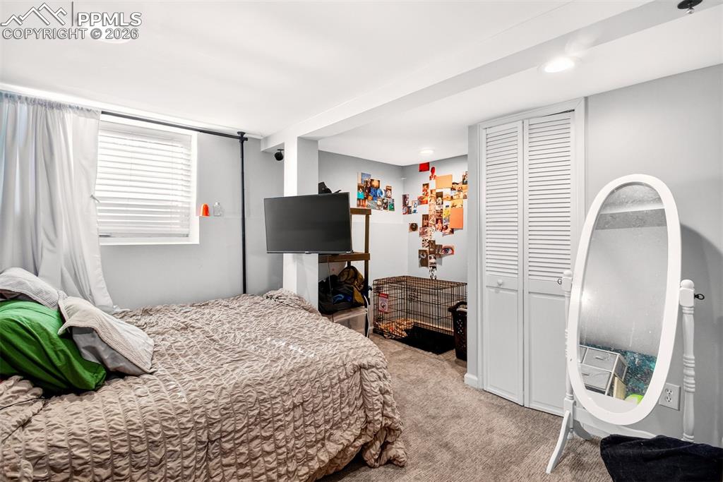 4 West Harrison Street Colorado Springs, CO 80907 - Photo 45 of 49 a bedroom with a bed and a couch