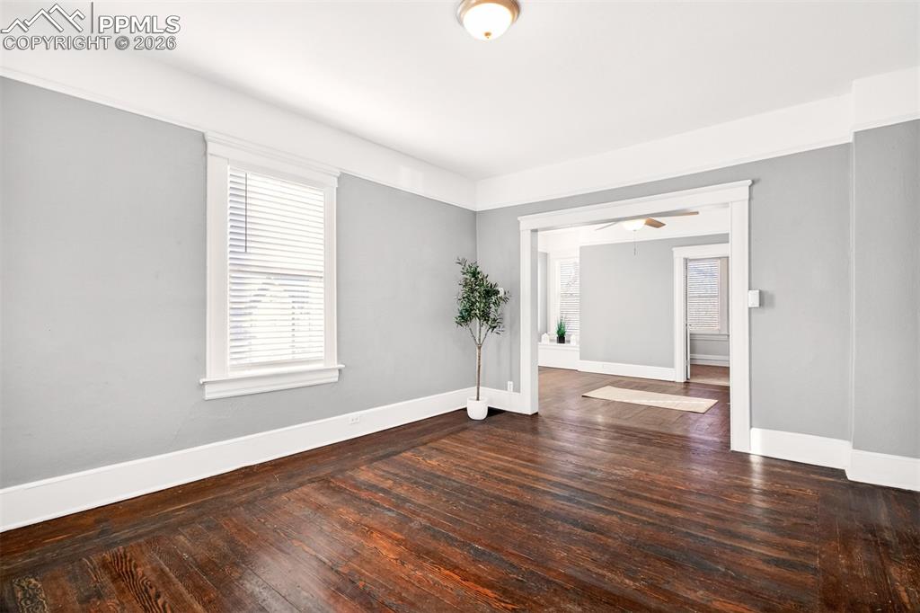4 West Harrison Street Colorado Springs, CO 80907 - Photo 5 of 49 an empty room with wooden floor and window