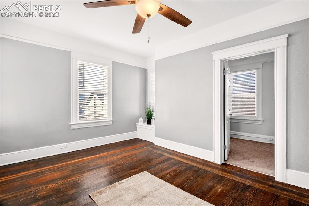4 West Harrison Street Colorado Springs, CO 80907 - Photo 7 of 49 a view of an empty room with wooden floor and a window