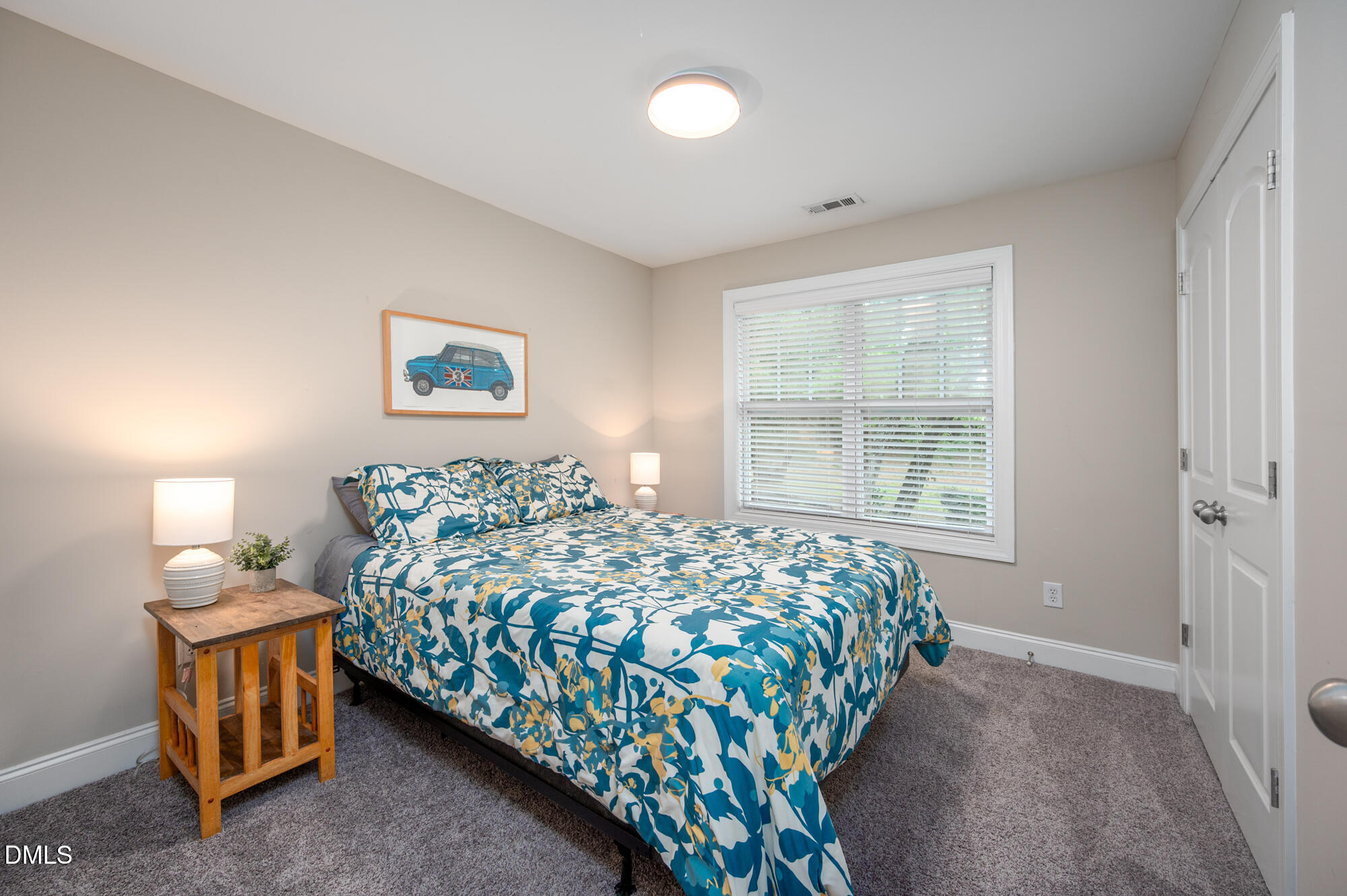 726 Ruth Circle Fuquay-Varina, NC 27526 - Photo 34 of 61 a bedroom with bed and a window