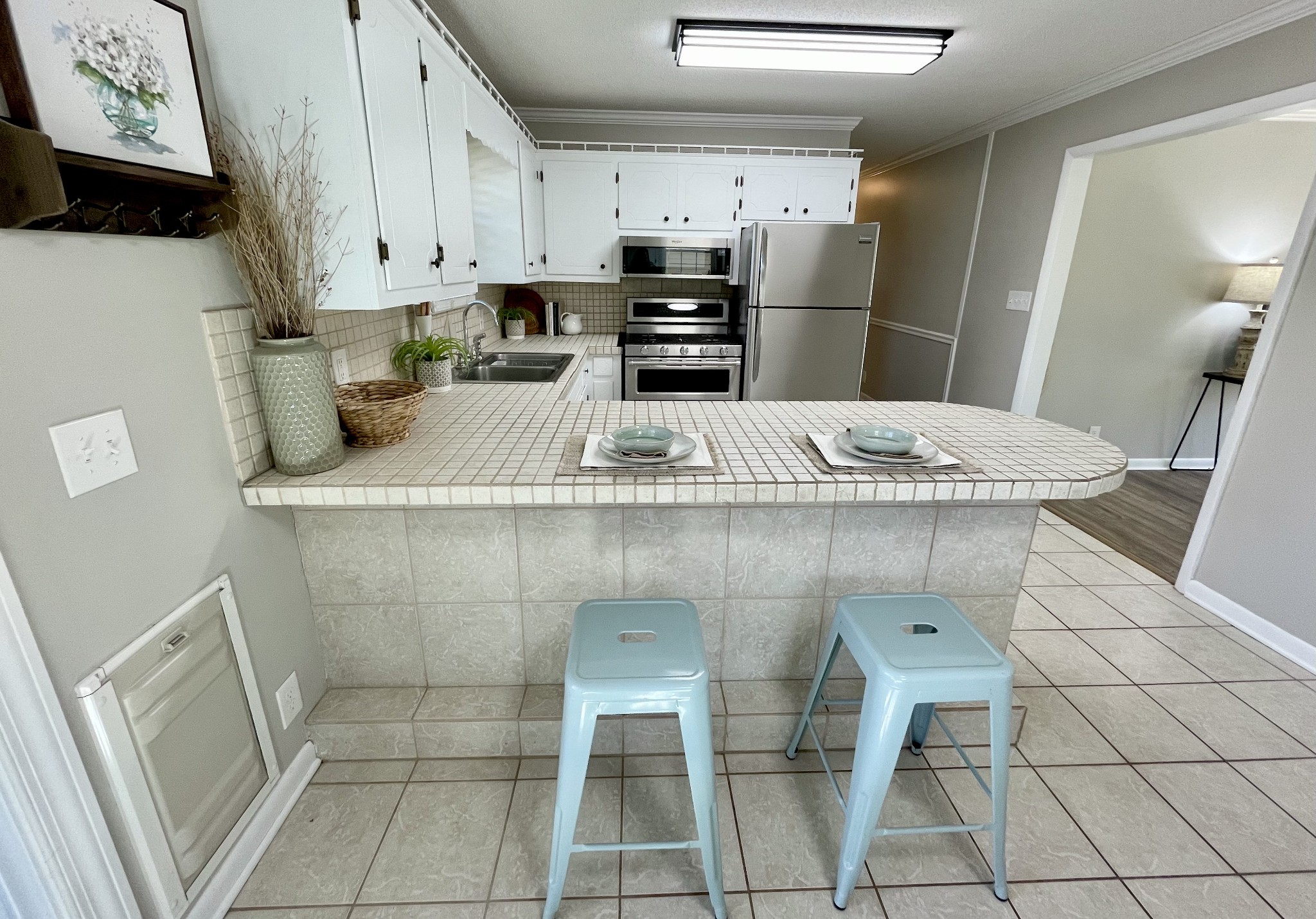 205 Wesley Chapel Road Lawrenceburg, TN 38464 - Photo 11 of 51 a kitchen with stainless steel appliances granite countertop a sink and a refrigerator