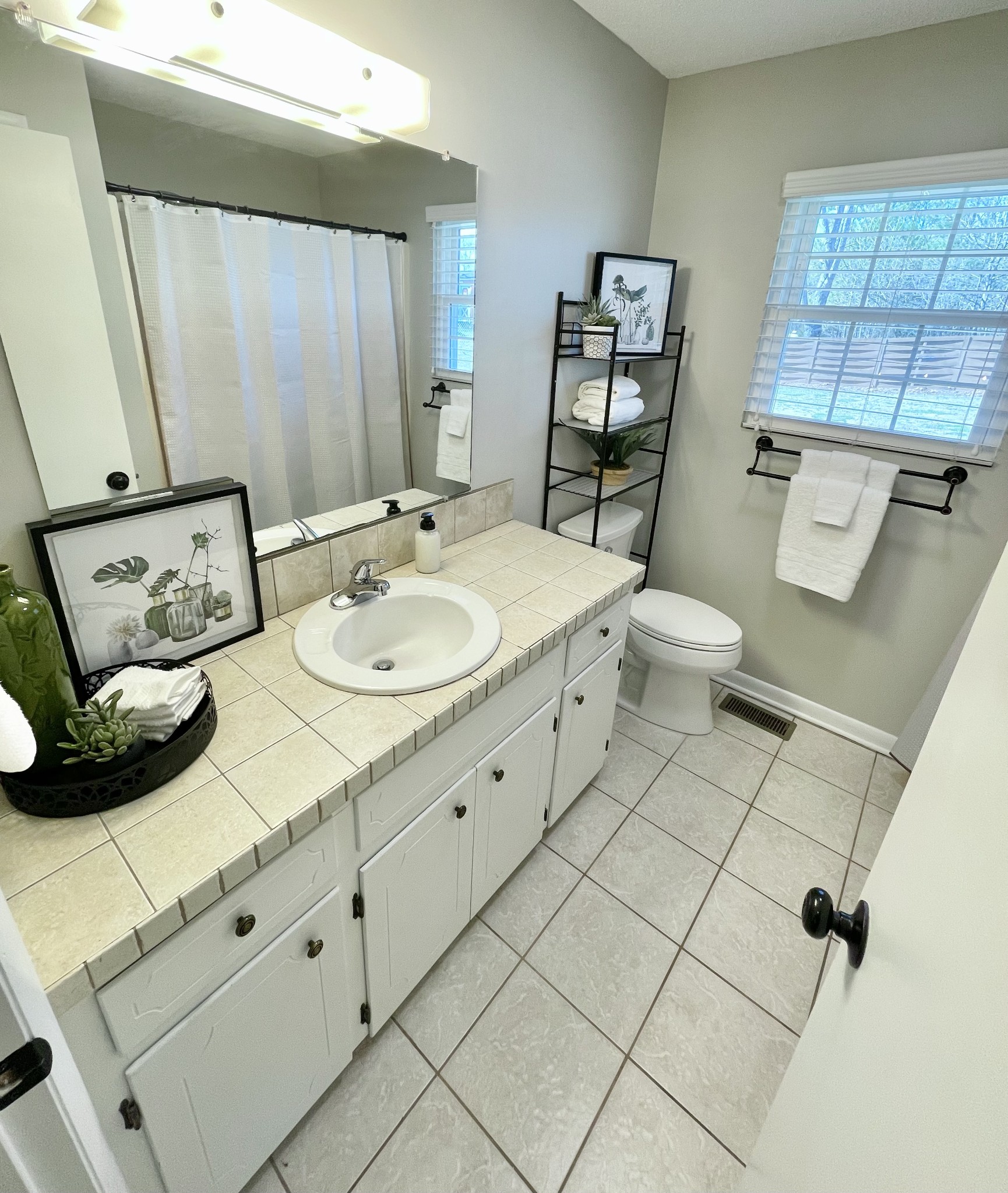 205 Wesley Chapel Road Lawrenceburg, TN 38464 - Photo 19 of 51 a spacious bathroom with a toilet sink and mirror