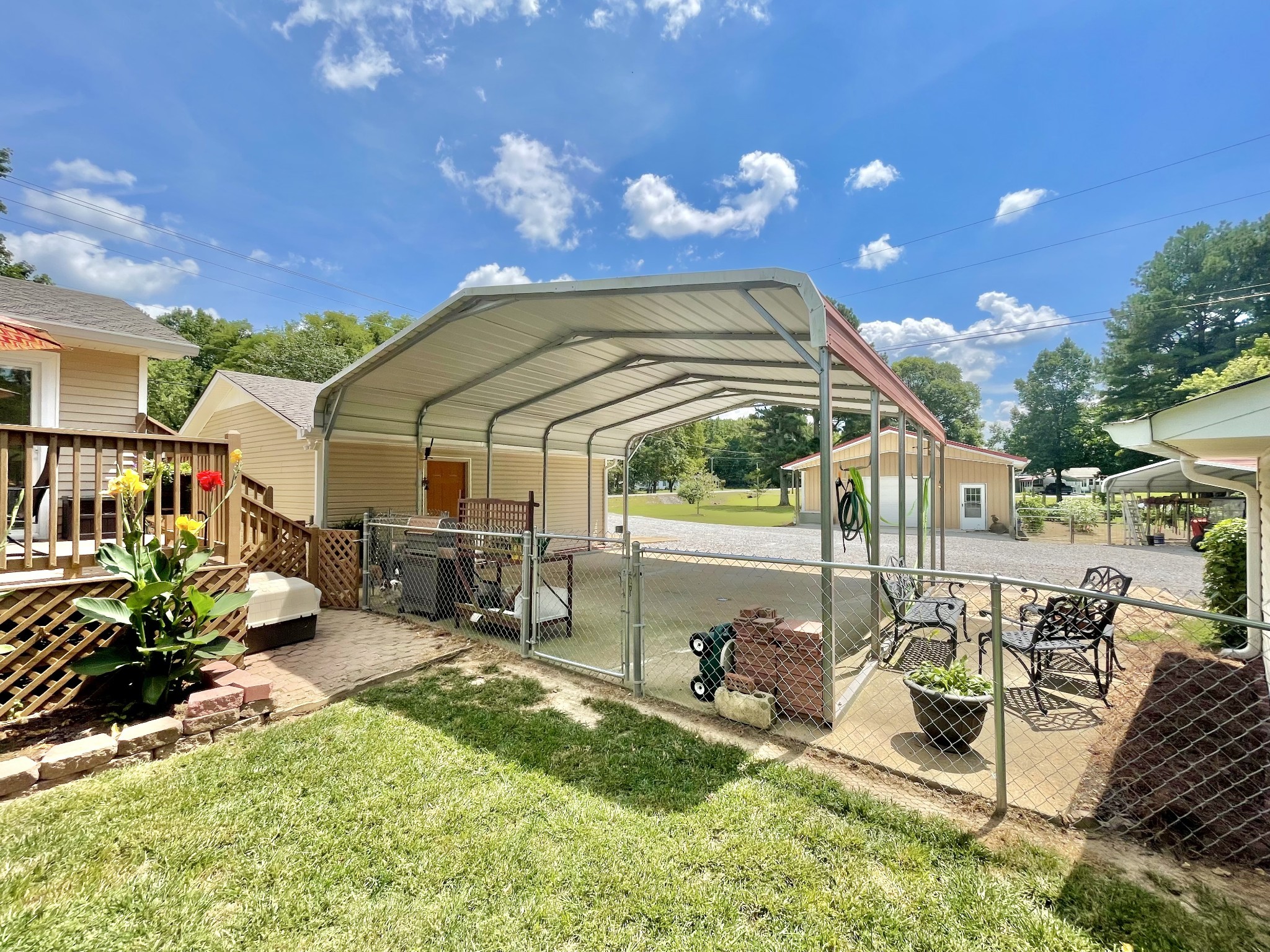 205 Wesley Chapel Road Lawrenceburg, TN 38464 - Photo 24 of 51 a view of the patio with dining table and chairs with a barbeque grill and a yard