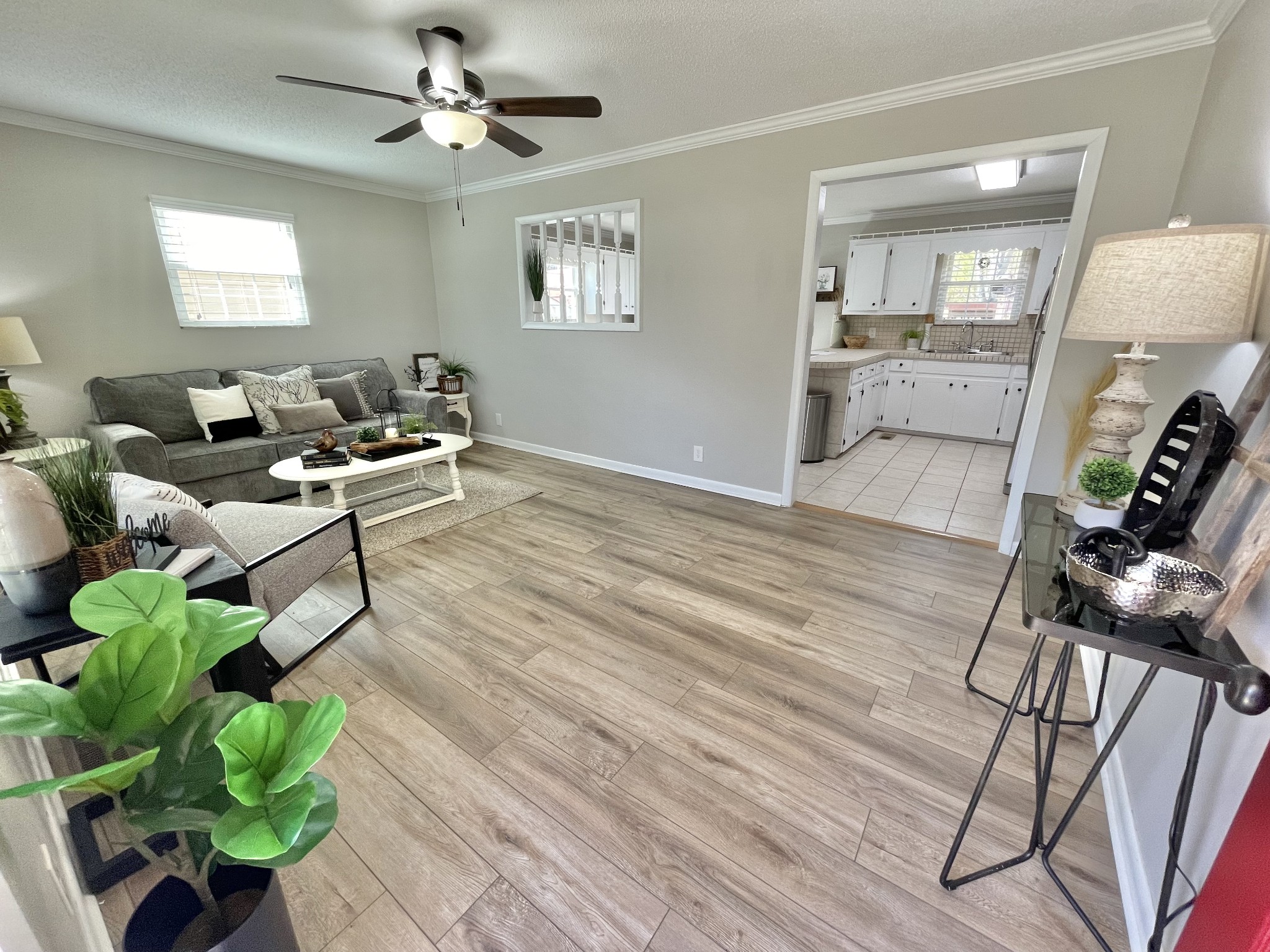 205 Wesley Chapel Road Lawrenceburg, TN 38464 - Photo 3 of 51 a living room with furniture a chandelier and a wooden floor