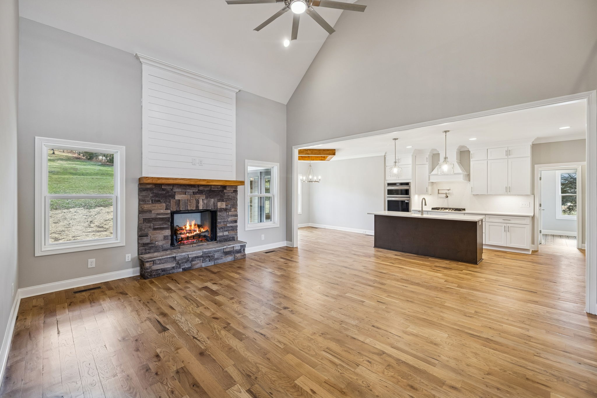 13821 Cainsville Road Lebanon, TN 37090 - Photo 13 of 68 a view of empty room with wooden floor and fireplace