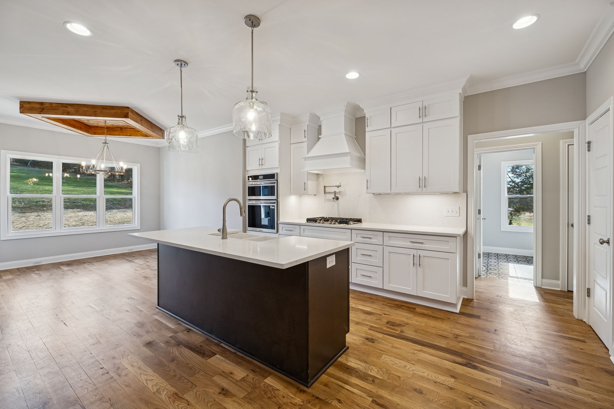 13821 Cainsville Road Lebanon, TN 37090 - Photo 16 of 68 a kitchen with stainless steel appliances granite countertop a sink a stove a refrigerator and island with wooden floor
