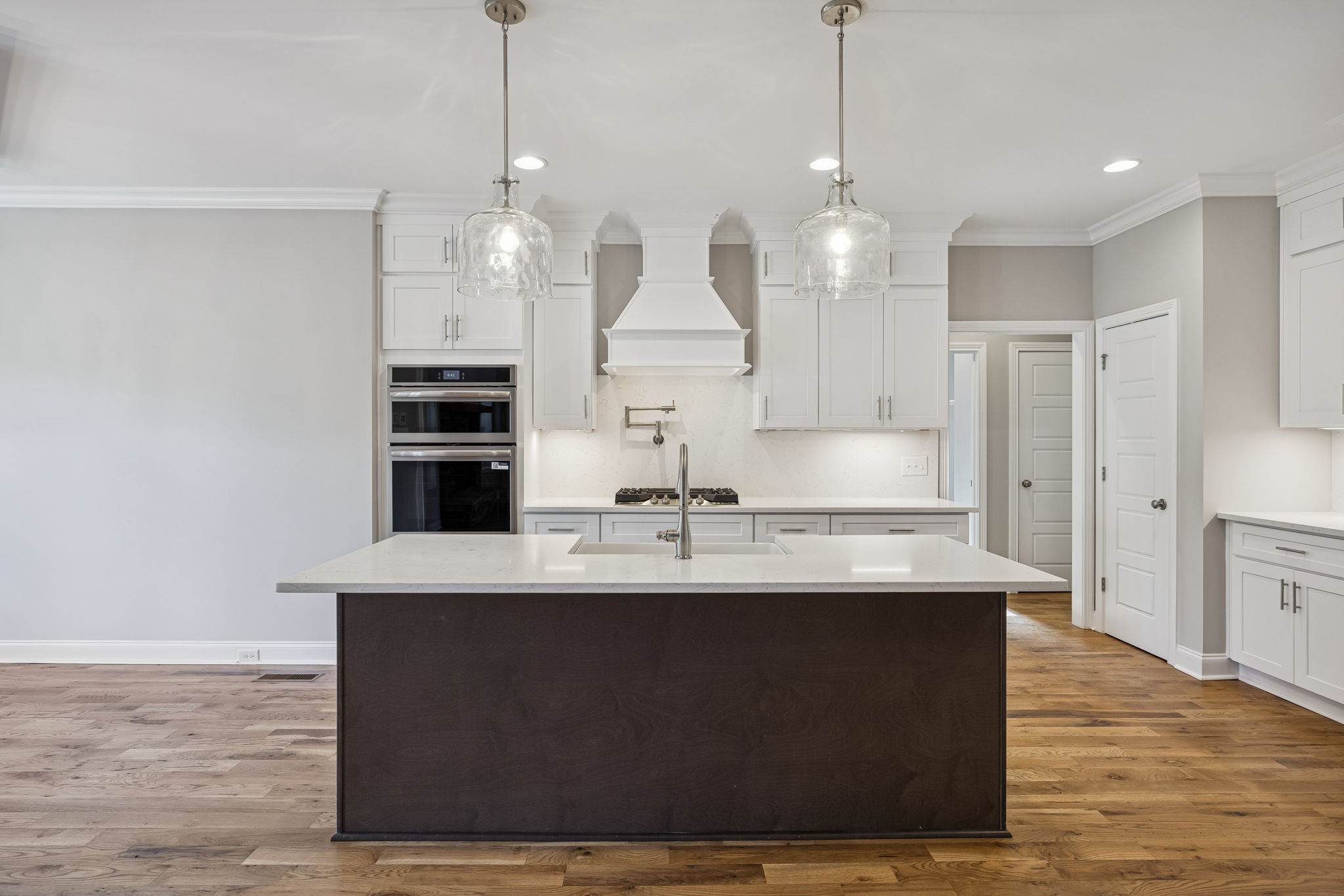 13821 Cainsville Road Lebanon, TN 37090 - Photo 17 of 68 a view of a kitchen counter top space a sink wooden floor and kitchen view