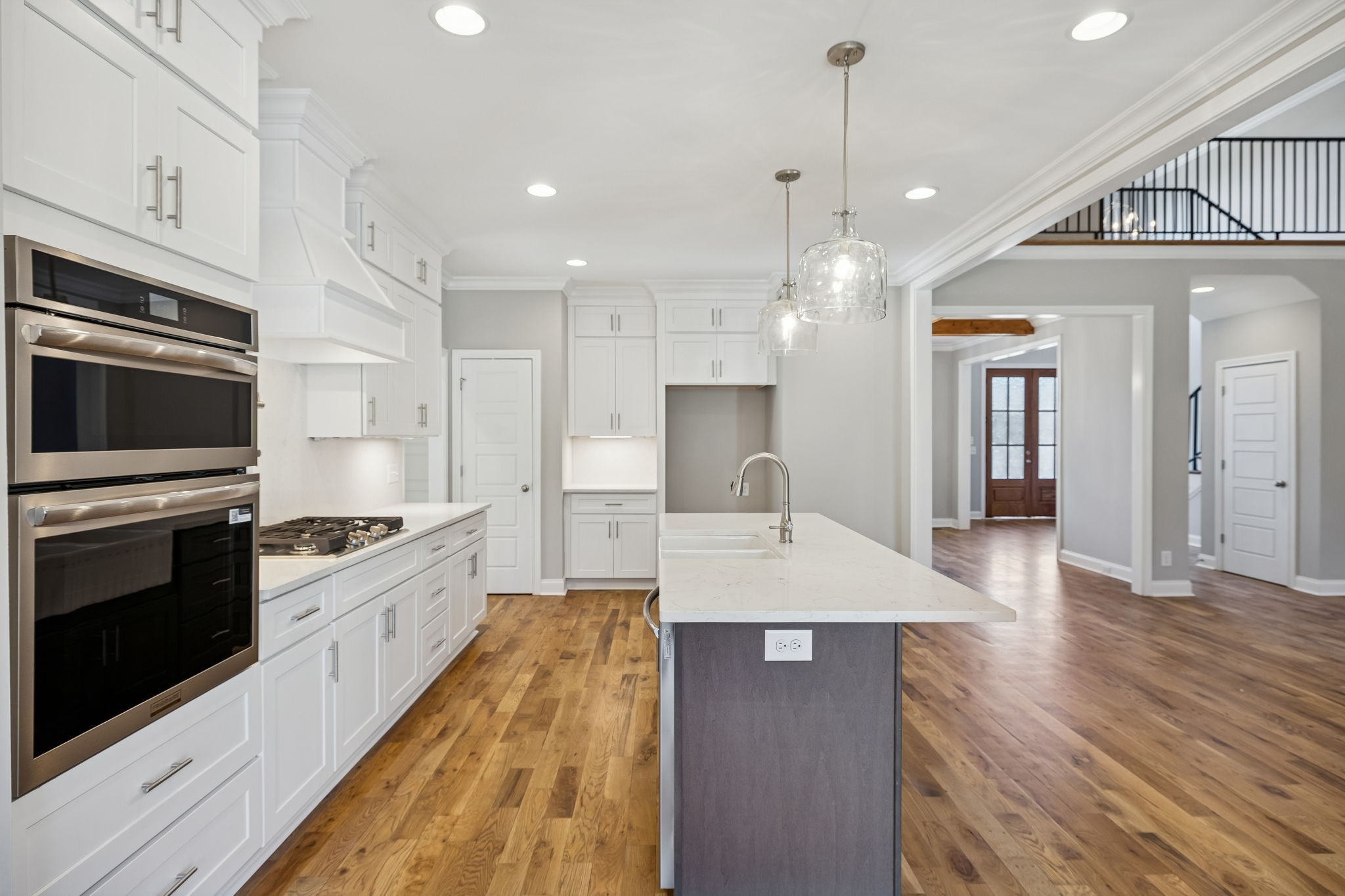 13821 Cainsville Road Lebanon, TN 37090 - Photo 18 of 68 a large kitchen with stainless steel appliances kitchen island granite countertop a stove a sink a refrigerator and a wooden floors