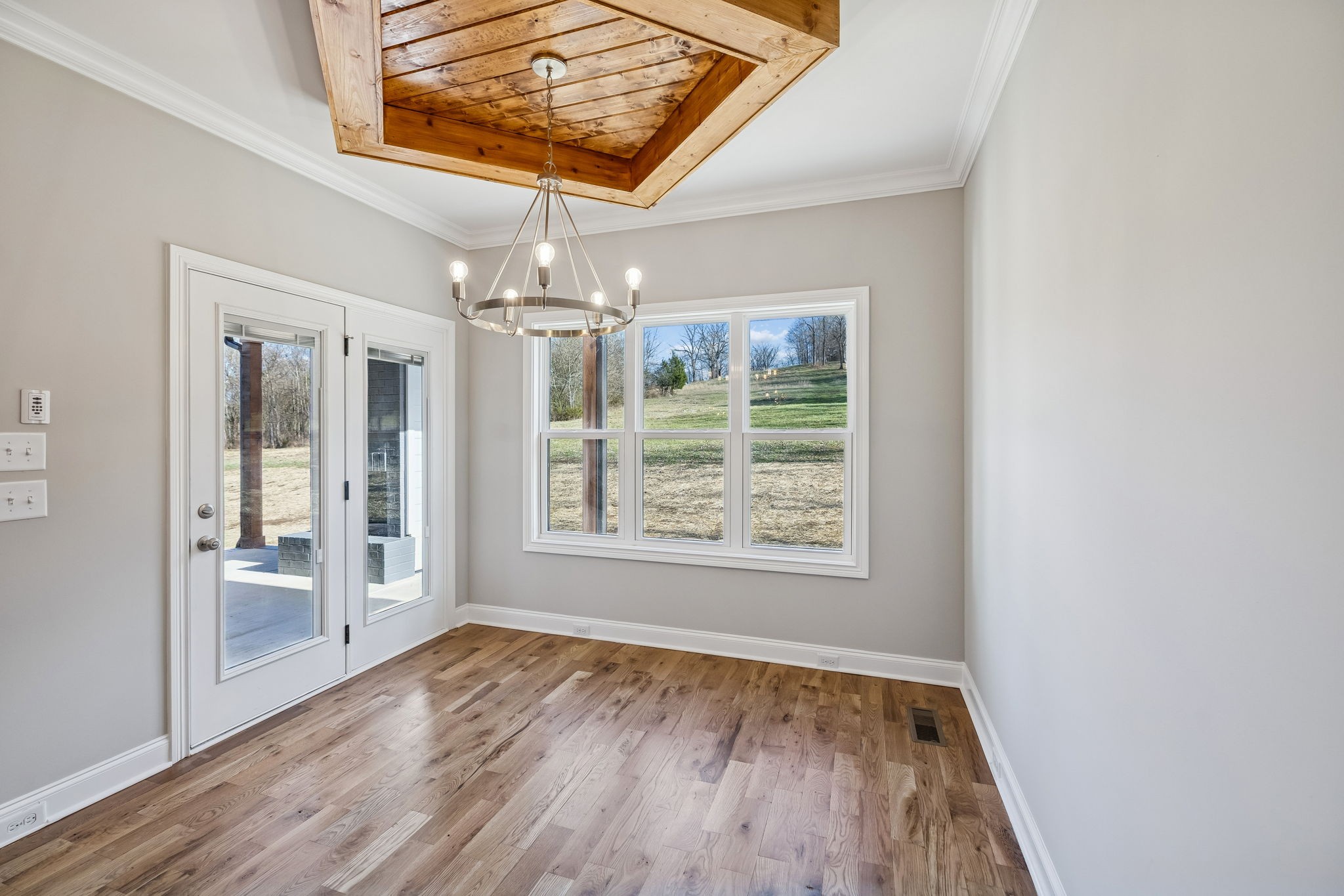 13821 Cainsville Road Lebanon, TN 37090 - Photo 19 of 68 an empty room with wooden floor and windows