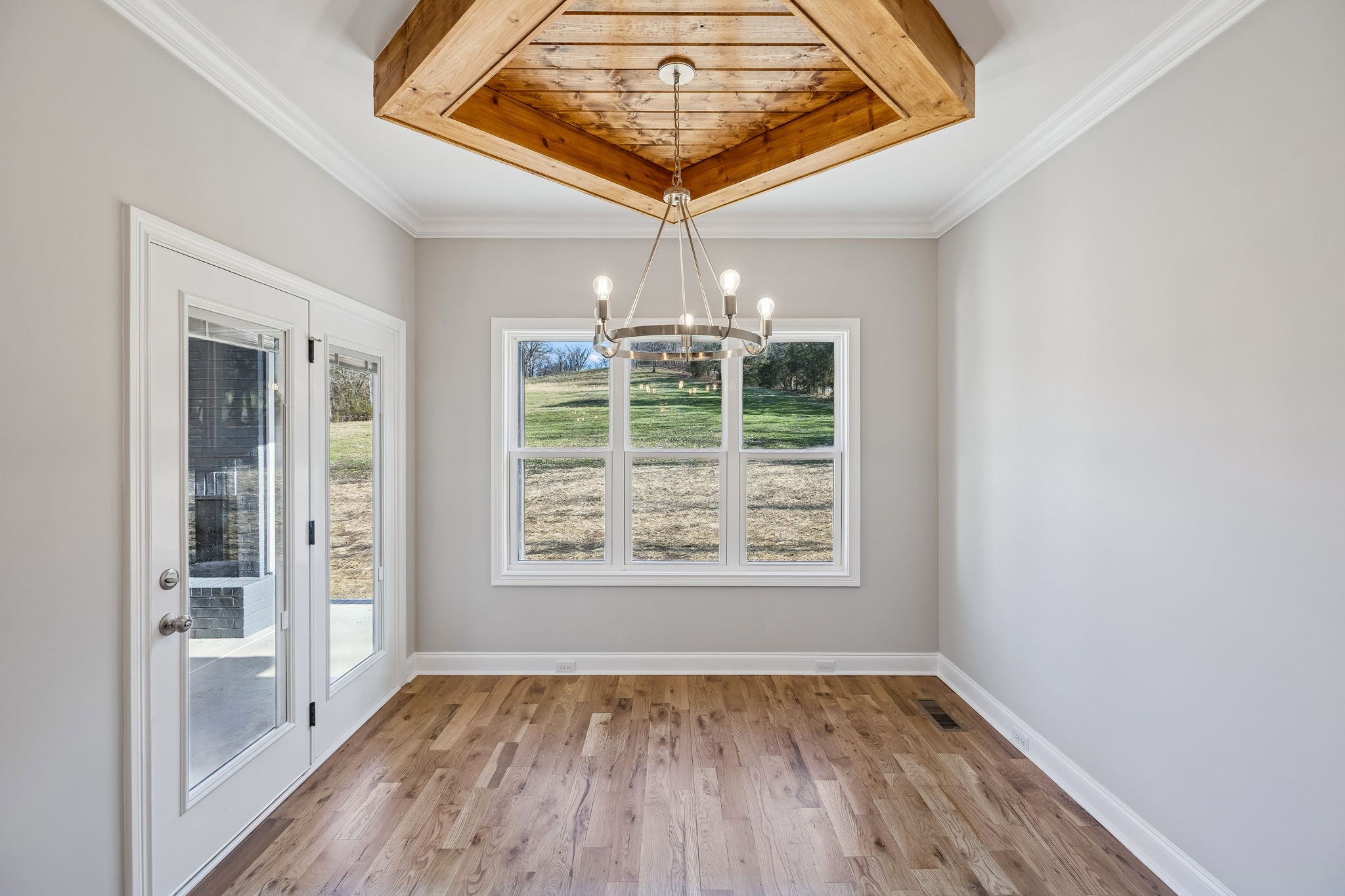 13821 Cainsville Road Lebanon, TN 37090 - Photo 20 of 68 a view of an empty room with wooden floor and a window