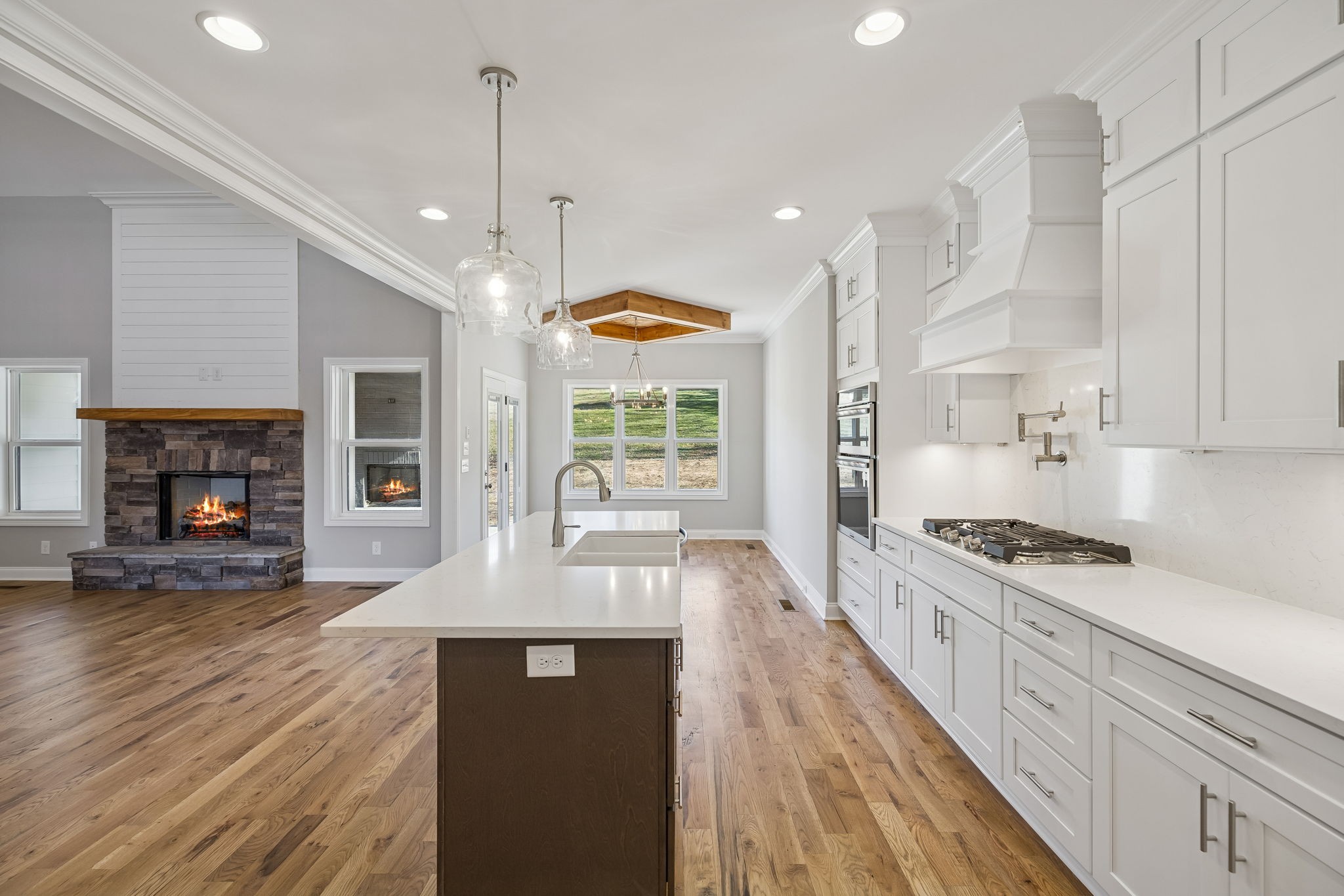 13821 Cainsville Road Lebanon, TN 37090 - Photo 22 of 68 a large kitchen with stainless steel appliances granite countertop a stove and a wooden floors
