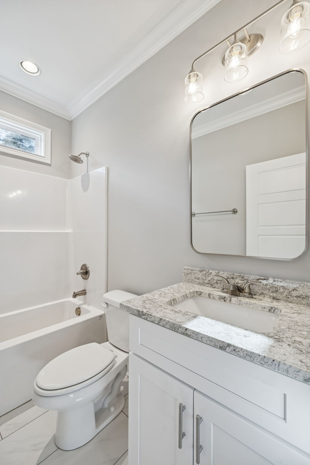 13821 Cainsville Road Lebanon, TN 37090 - Photo 24 of 68 a bathroom with a granite countertop sink a toilet and a bathtub