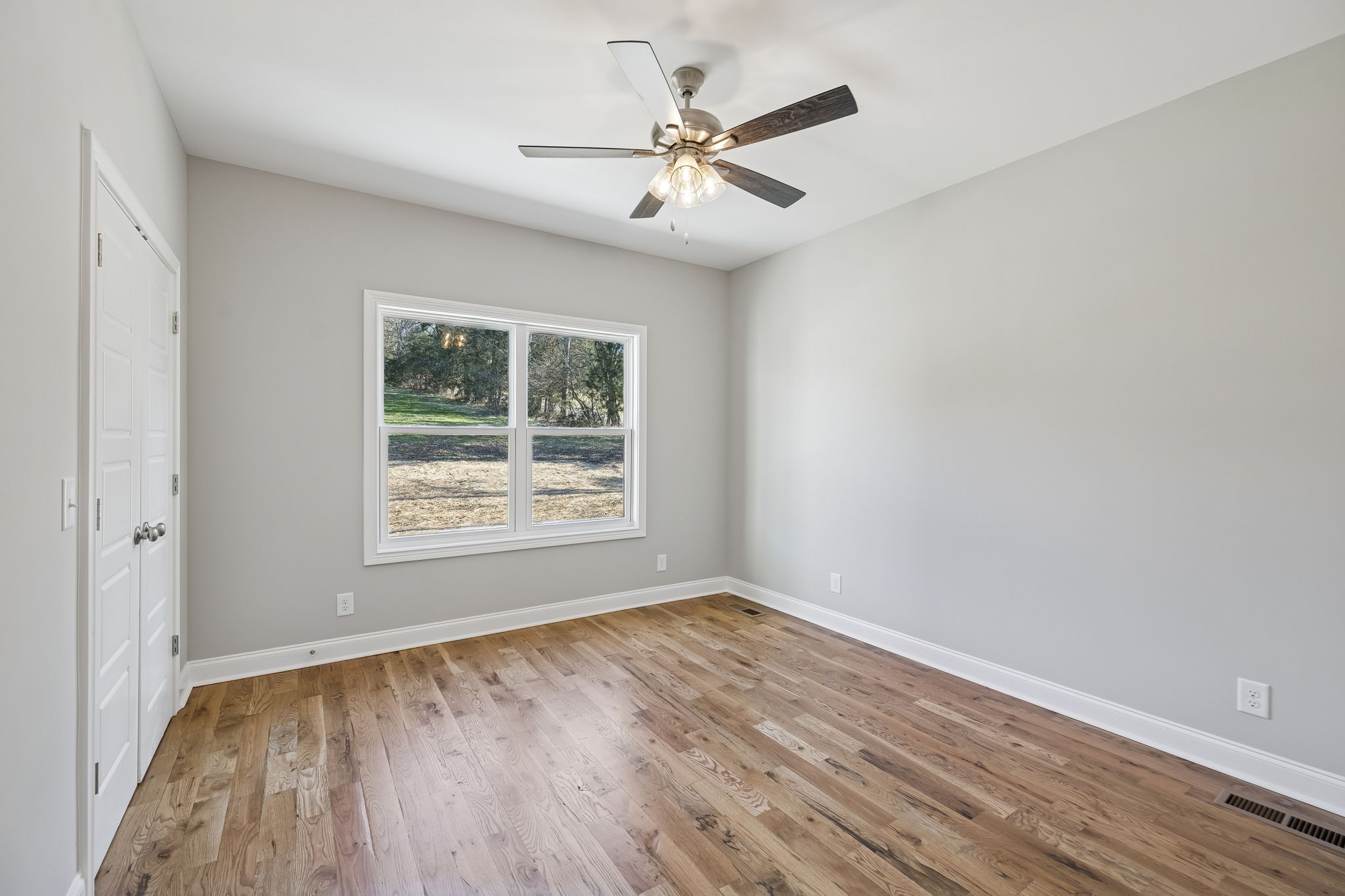 13821 Cainsville Road Lebanon, TN 37090 - Photo 25 of 68 wooden floor in an empty room with a window