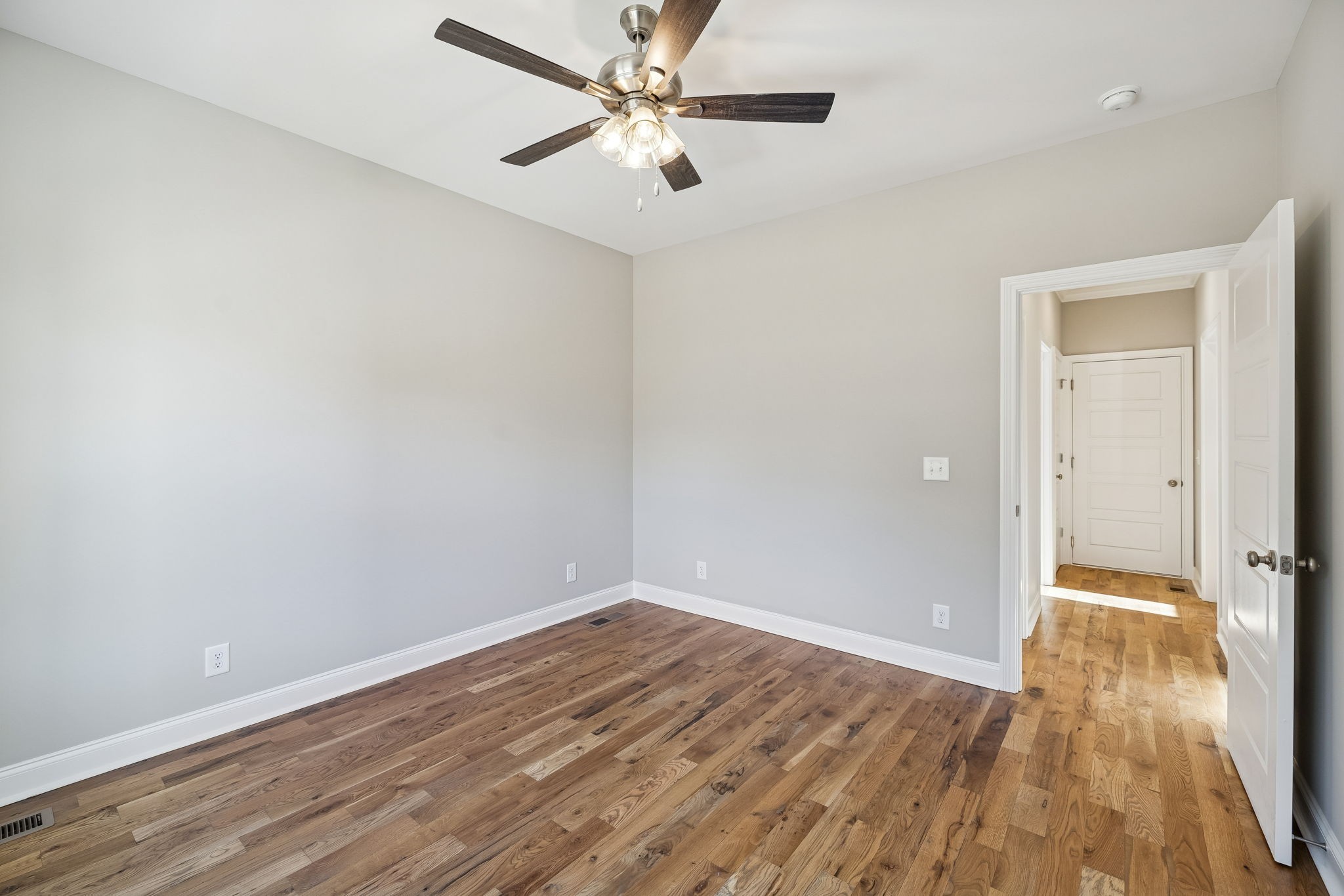 13821 Cainsville Road Lebanon, TN 37090 - Photo 27 of 68 a view of a room with wooden floor and a ceiling fan