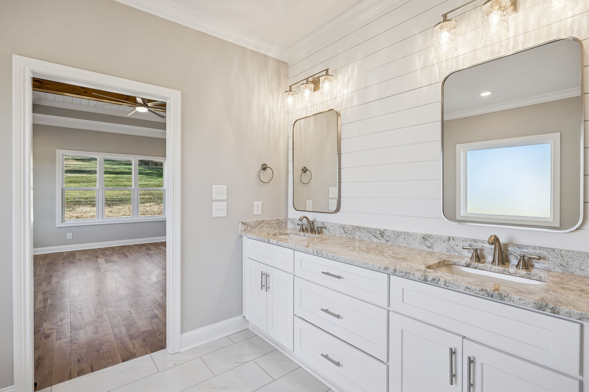 13821 Cainsville Road Lebanon, TN 37090 - Photo 38 of 68 a bathroom with double sink and a mirror