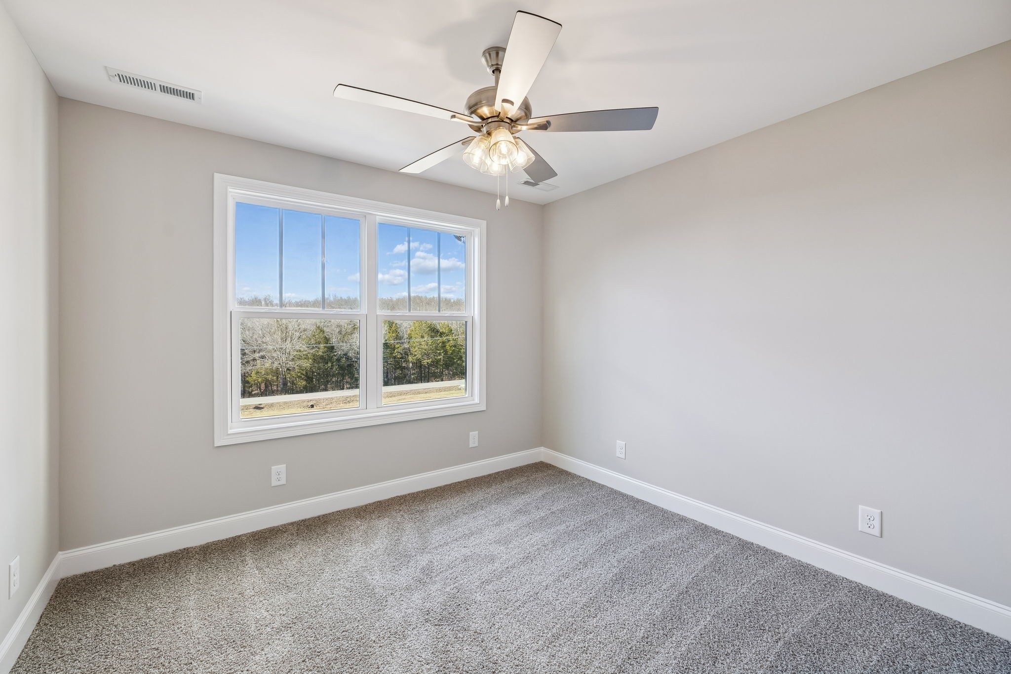 13821 Cainsville Road Lebanon, TN 37090 - Photo 42 of 68 an empty room with a window and a fan