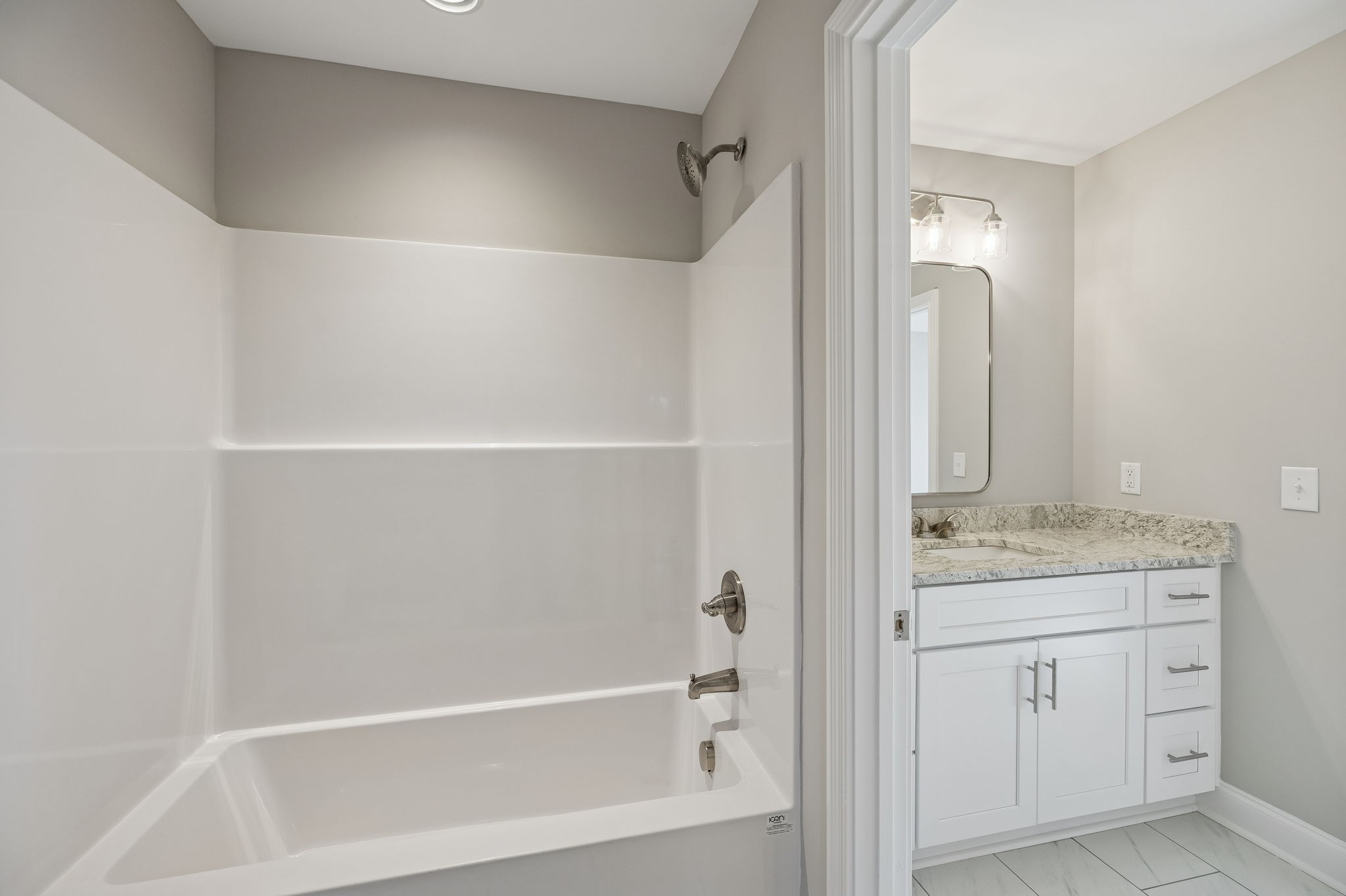 13821 Cainsville Road Lebanon, TN 37090 - Photo 45 of 68 a bathroom with a granite countertop sink a toilet and shower