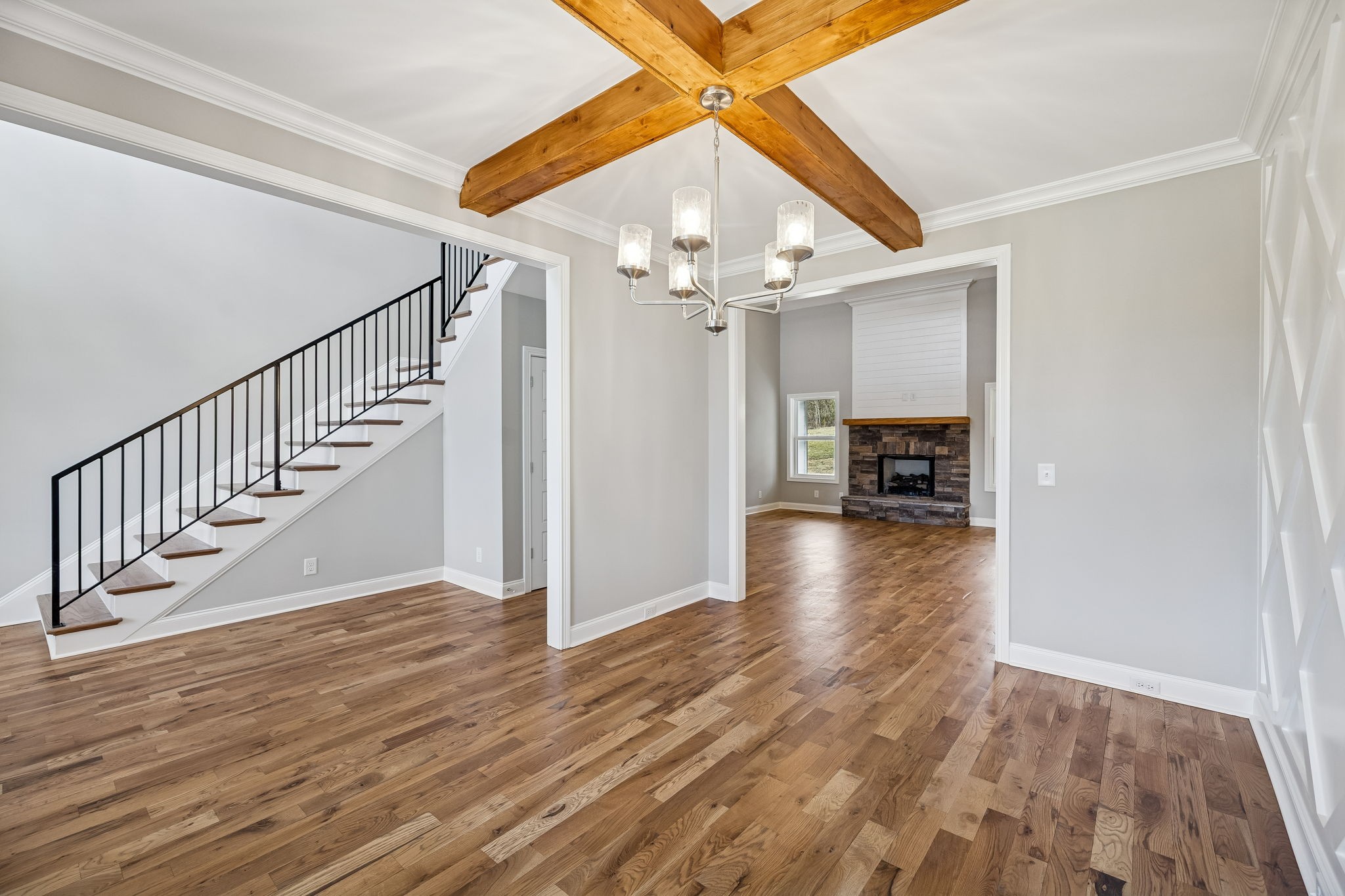 13821 Cainsville Road Lebanon, TN 37090 - Photo 10 of 68 a view of a livingroom with wooden floor a ceiling fan and staircase