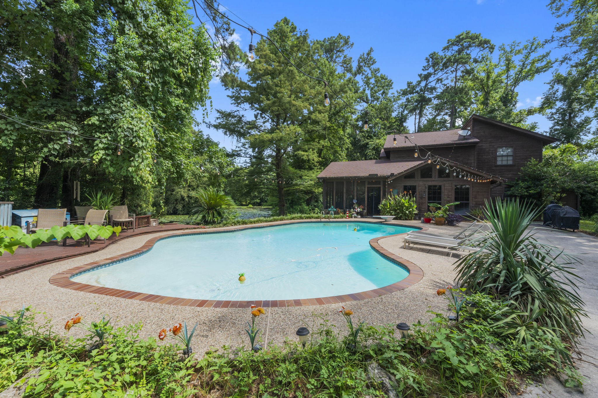 426 Nursery Road The Woodlands, TX 77380 - Photo 17 of 41 an outdoor space with swimming pool and furniture