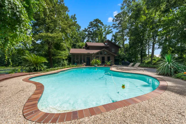a view of a swimming pool with a patio